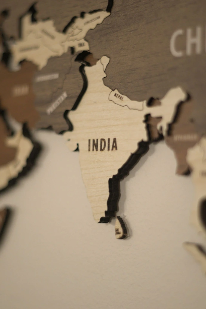 A wooden map of the world with countries